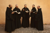 5 monks holding books